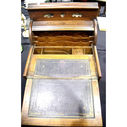 1386 - Oak writing box with tambour front, lifting lid and drawer with perpetual calendar to top. Not avail... 