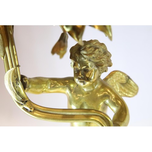 1342 - 19th century gilt bronze two sconce candelabra, the body in the form of a putti grasping a floral vi... 