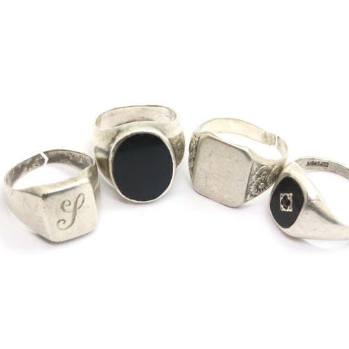 1064 - Four silver gents rings. P&P Group 1 (£14+VAT for the first lot and £1+VAT for subsequent lots)
Cond... 