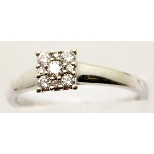 1070 - 9ct white gold, diamond cluster engagement ring, size Q, 2.5g. P&P Group 1 (£14+VAT for the first lo... 