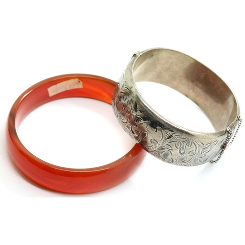 1125 - Hallmarked silver bangle and a red agate bangle. P&P Group 1 (£14+VAT for the first lot and £1+VAT f... 