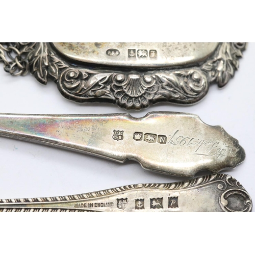 1338 - Two hallmarked silver teaspoons and a hallmarked silver sherry decanter label, total weight 60g, var... 