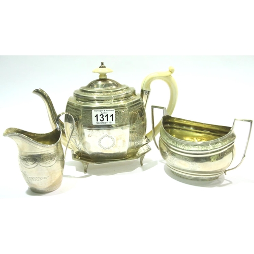 1311 - George III hallmarked silver tea service of ivory mounted teapot with stand, sugar bowl and milk jug... 