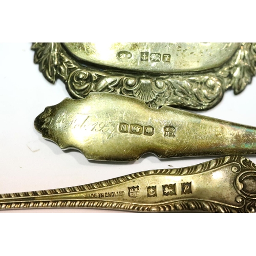 1338 - Two hallmarked silver teaspoons and a hallmarked silver sherry decanter label, total weight 60g, var... 