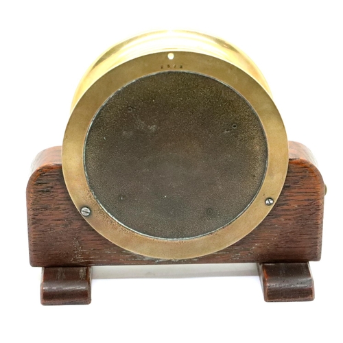 1433 - Heavy brass port hole type clock on wood stand by the Chelsea Clock Co, USA. P&P Group 3 (£25+VAT fo... 