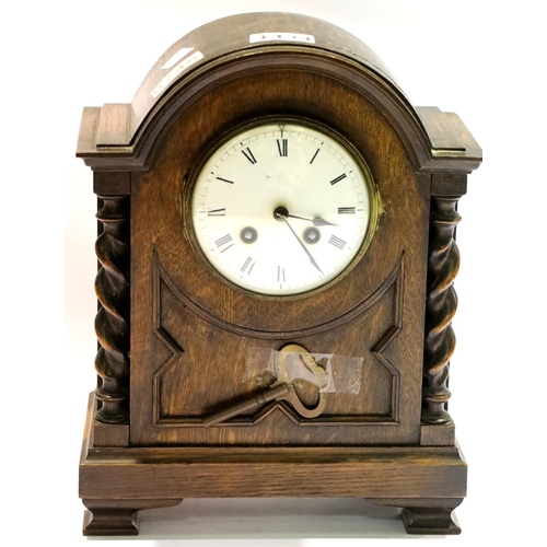 1434 - Oak cased chiming mantel clock with barley twist columns. Not available for in-house P&P