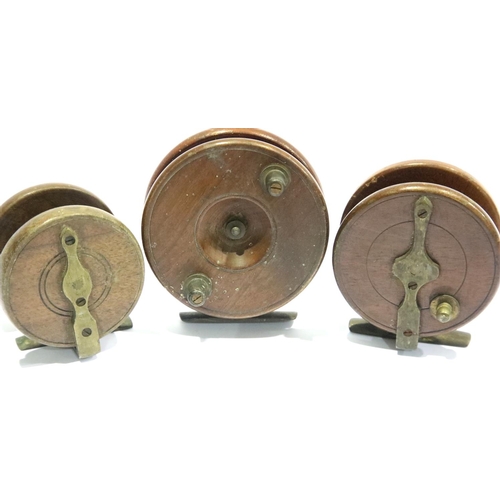 1511 - Three wood and brass centre pin fishing reels, two marked Made in England, one S Allcock & Co. P&P G... 