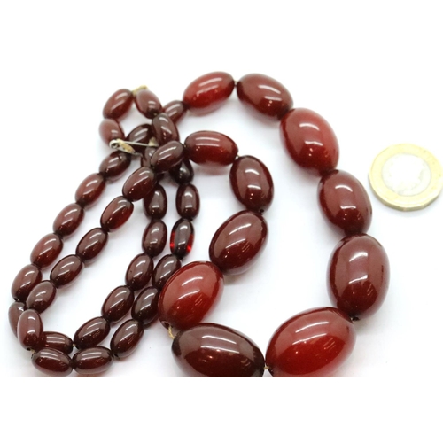 1112A - Set of amber beads 1930s, L: 66 cm, largest bead: 24 x 18 mm, 61.1g. P&P Group 1 (£14+VAT for the fi... 
