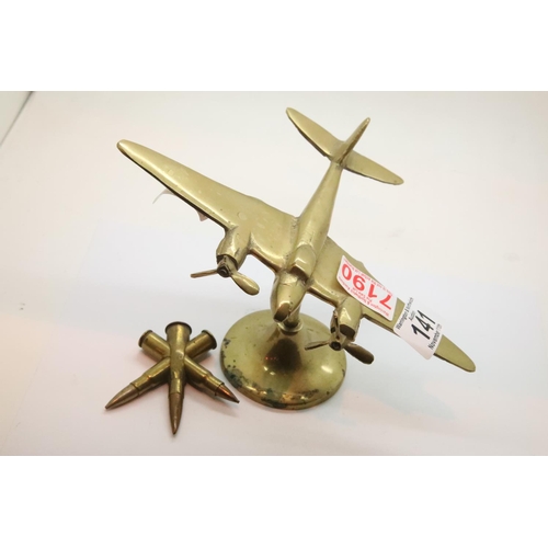 141 - Brass desk paperweight of an Air Force bomber and a piece of trench art. P&P Group 1 (£14+VAT for th... 