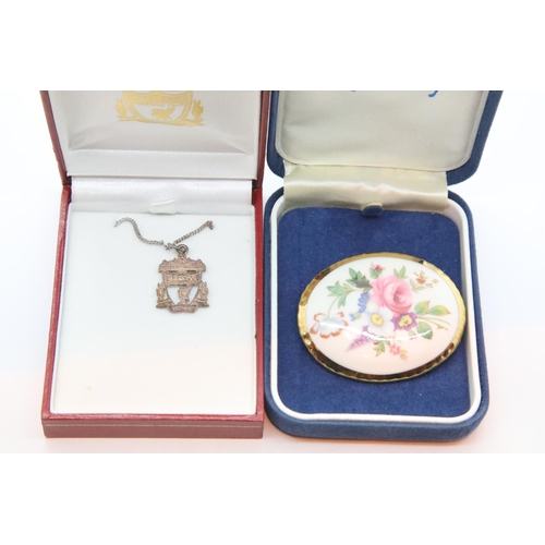 144 - Aynsley porcelain brooch and a hallmarked silver Liverpool FC pendant. P&P Group 1 (£14+VAT for the ... 