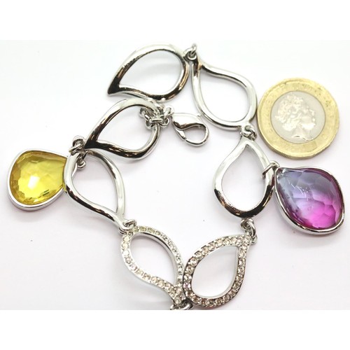 1103 - Boxed Swarovski bracelet with purple and yellow stones. P&P Group 1 (£14+VAT for the first lot and £... 