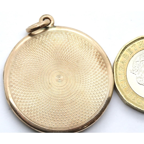 1050 - Presumed 9ct gold circular locket with machine turned decoration, unmarked, D: 31 mm, 10.7g. P&P Gro... 