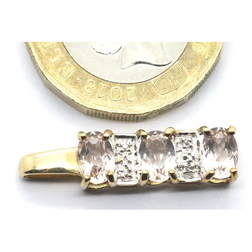 1062 - Presumed 9ct gold pendant set with three stones, L: 24 mm, 1.5g. P&P Group 1 (£14+VAT for the first ... 