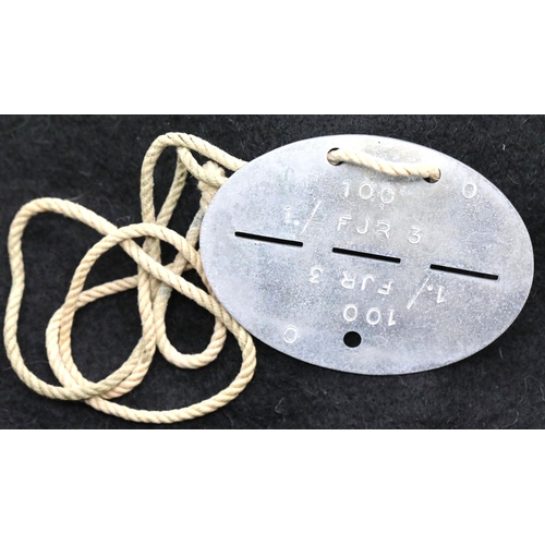 1244 - German WWII type Wehrmacht dog tag disc. P&P Group 1 (£14+VAT for the first lot and £1+VAT for subse... 