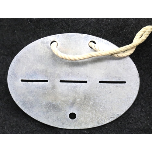 1244 - German WWII type Wehrmacht dog tag disc. P&P Group 1 (£14+VAT for the first lot and £1+VAT for subse... 