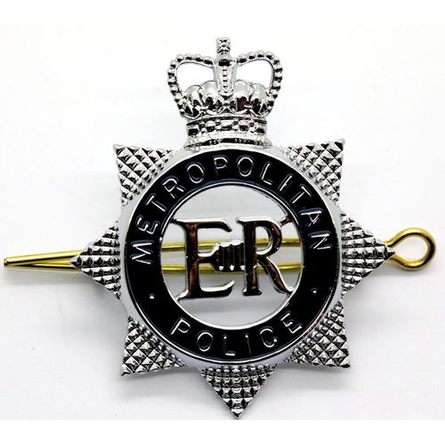 1302 - Metropolitan Police enamelled metal cap badge, unused. P&P Group 1 (£14+VAT for the first lot and £1... 