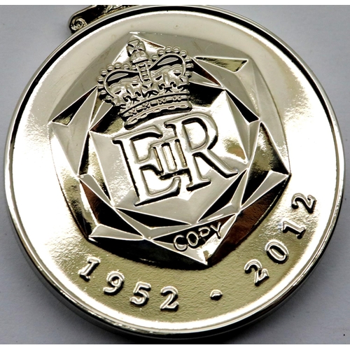 1303 - Elizabeth II 60 Year commemorative medal. P&P Group 1 (£14+VAT for the first lot and £1+VAT for subs... 