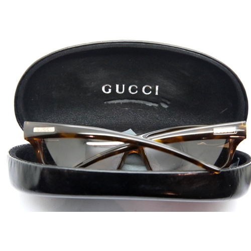 1309 - Pair of Gucci sunglasses with tortoiseshell style frames, boxed. P&P Group 1 (£14+VAT for the first ... 