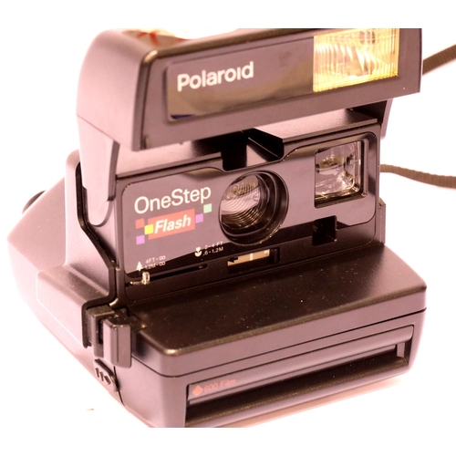 1439 - Three Polaroid cameras, black Polaroid 660, silver Polaroid 600 and black Polaroid 600, all have fla... 