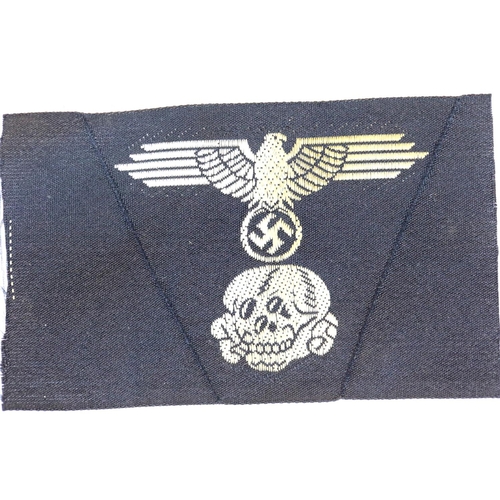 3099 - German WWII type embroidered SS cap eagle with Totenkopf skull, unused. P&P Group 1 (£14+VAT for the... 