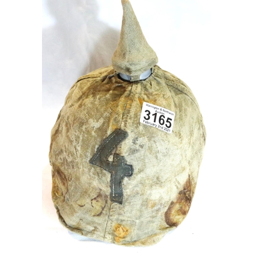 3165 - Imperial German or Prussian type pickelhaube, with leather liner (damaged) and canvas cover numbered... 