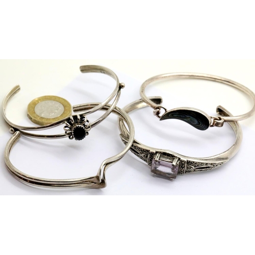 1008 - Four silver bangles, combined 51g. P&P Group 1 (£14+VAT for the first lot and £1+VAT for subsequent ... 