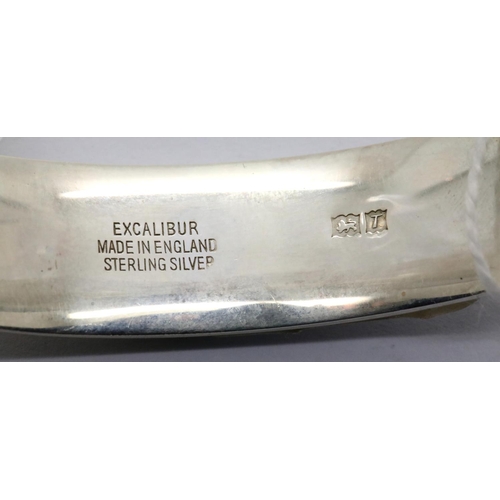 1009 - Hallmarked silver engraved bangle with safety chain, 26g. P&P Group 1 (£14+VAT for the first lot and... 