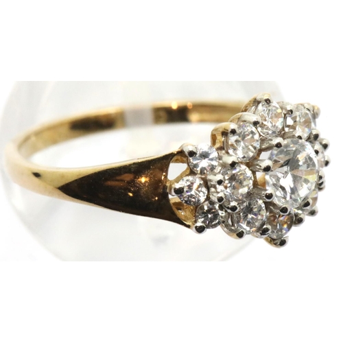 1080 - 9ct yellow gold cubic zirconia set flower head ring, size N, 2.4g. P&P Group 1 (£14+VAT for the firs... 