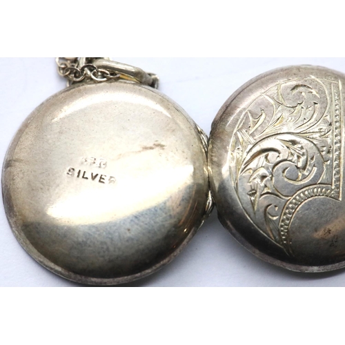 1149 - Three silver pendants on silver chains including a locket. P&P Group 1 (£14+VAT for the first lot an... 