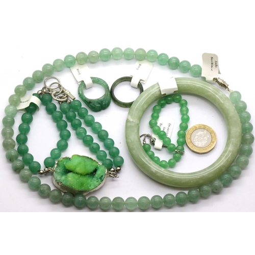 1150 - Two jade rings, a jade bangle, two jade bracelets and a necklace. P&P Group 1 (£14+VAT for the first... 