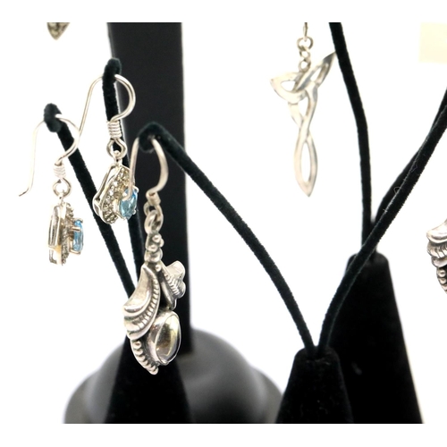 1155 - Seven pairs of silver earrings on display stands. P&P Group 1 (£14+VAT for the first lot and £1+VAT ... 