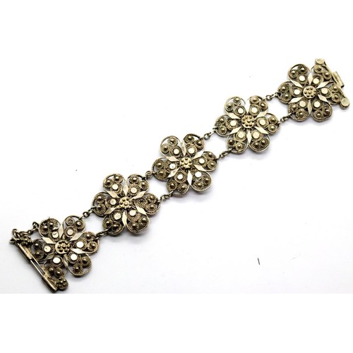 1138 - White metal filigree bracelet, probably silver, 30g. P&P Group 1 (£14+VAT for the first lot and £1+V... 