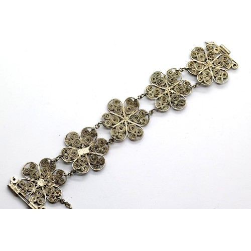 1138 - White metal filigree bracelet, probably silver, 30g. P&P Group 1 (£14+VAT for the first lot and £1+V... 