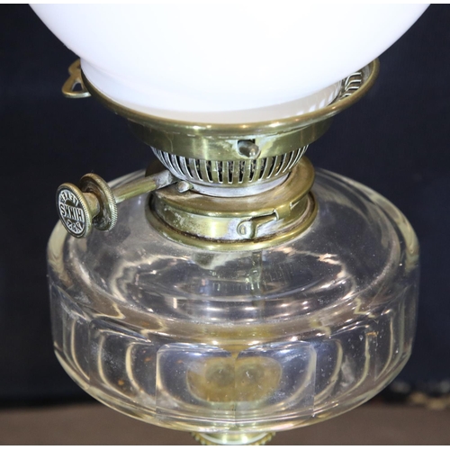 1406 - Victorian brass based oil lamp with glass reservoir and milk glass shade, H: 50 cm. Not available fo... 