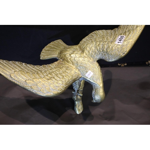 1408 - Large brass eagle perched on a rock, wingspan: 65 cm. P&P Group 3 (£25+VAT for the first lot and £5+... 