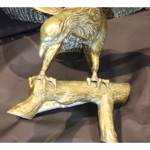 1408 - Large brass eagle perched on a rock, wingspan: 65 cm. P&P Group 3 (£25+VAT for the first lot and £5+... 