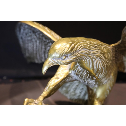 1408 - Large brass eagle perched on a rock, wingspan: 65 cm. P&P Group 3 (£25+VAT for the first lot and £5+... 