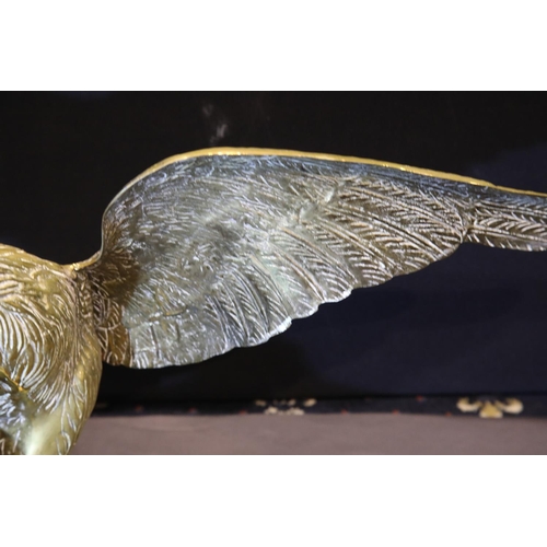 1408 - Large brass eagle perched on a rock, wingspan: 65 cm. P&P Group 3 (£25+VAT for the first lot and £5+... 