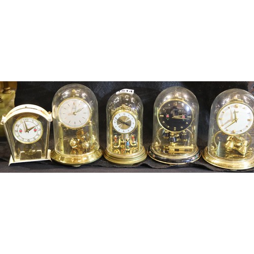 1514 - Four small 20th century glass domed anniversary clocks and a Schatz eight-day clock. Not available f... 