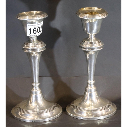 1602 - Pair of hallmarked silver weighted candlesticks, Birmingham assay 1912 by William Aitkin, H: 20 cm. ... 