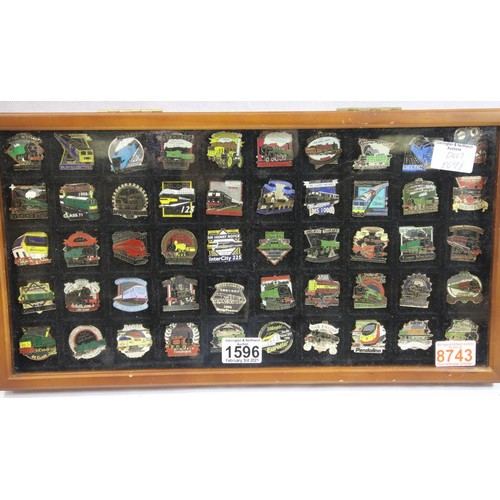 1596 - Glazed display case containing 50 railway related pin badges. P&P Group 3 (£25+VAT for the first lot... 