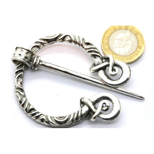 67 - White metal Norse type penannular cloak pin. P&P Group 1 (£14+VAT for the first lot and £1+VAT for s... 