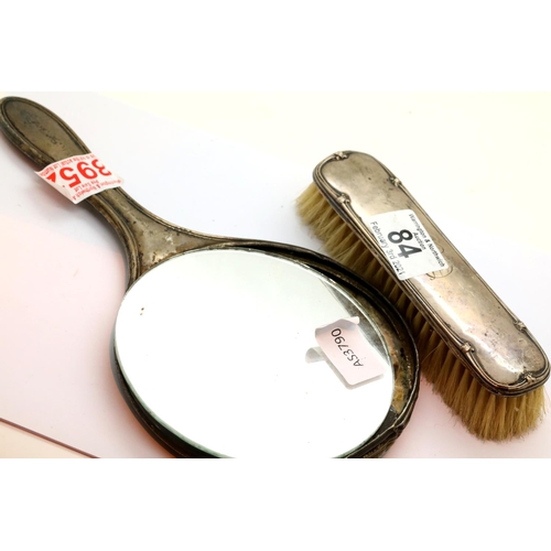 84 - Hallmarked silver hand mirror and brush (loose glass). P&P Group 1 (£14+VAT for the first lot and £1... 