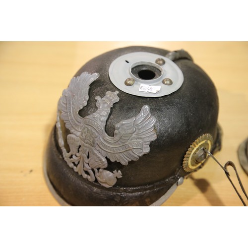 3165 - Imperial German or Prussian type pickelhaube, with leather liner (damaged) and canvas cover numbered... 