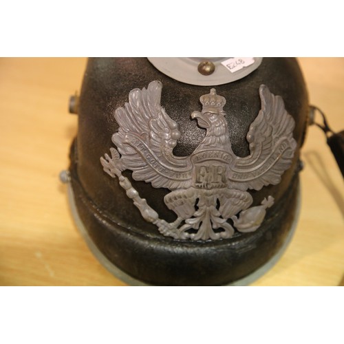 3165 - Imperial German or Prussian type pickelhaube, with leather liner (damaged) and canvas cover numbered... 