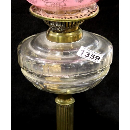 1359 - Victorian brass oil lamp with Cranberry glass shade, H: 90 cm. Not available for in-house P&P, conta... 