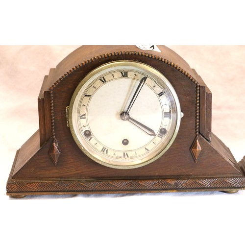 1487 - Walnut cased mantel clock, working at time of lotting, and an oak cased example with Westminster chi... 