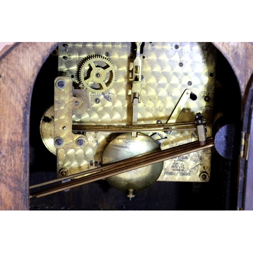 1487 - Walnut cased mantel clock, working at time of lotting, and an oak cased example with Westminster chi... 