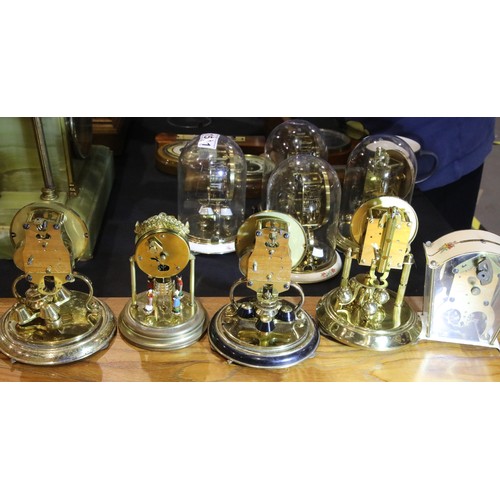 1514 - Four small 20th century glass domed anniversary clocks and a Schatz eight-day clock. Not available f... 