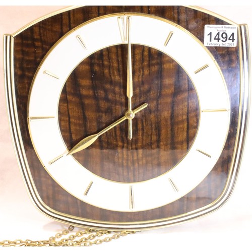 1494 - 1970's chain driven wall clock, lacking glass, weights and pendulum, not working at time of lotting,... 